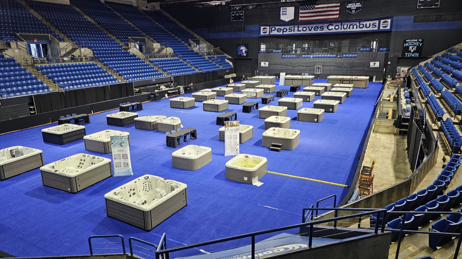 Rows of hot tubs and swim spas at the expo